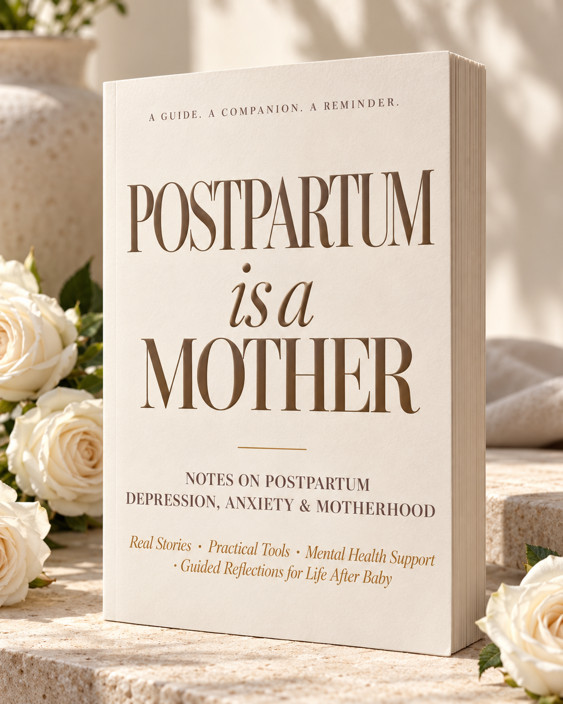 Photographic book mockup of Postpartum Is a Mother: an ivory paperback with taupe lettering, visible pages, and white roses on pale stone